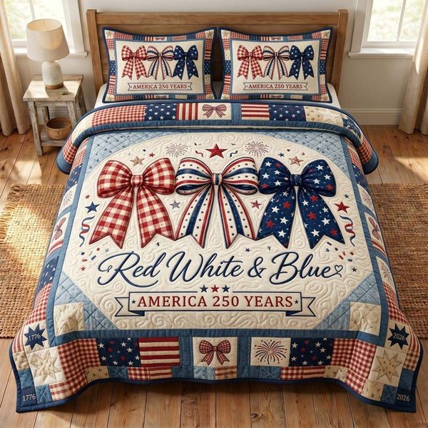Americana Cherries quilted 3-piece bedding set on a made bed in a warmly lit bedroom