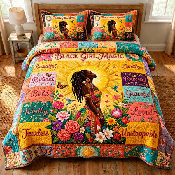 Black Girl Magic quilted 3-piece bedding set on a made bed with two matching pillow shams