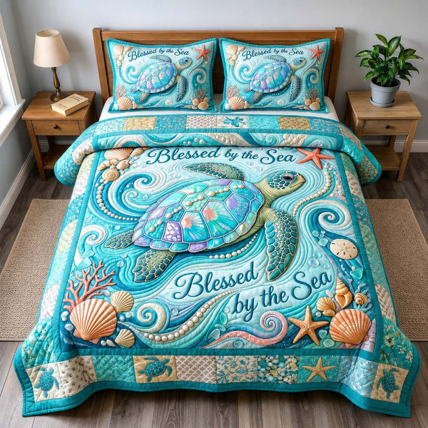Blessed by the Sea quilted 3-piece bedding set on a made bed in a softly lit bedroom