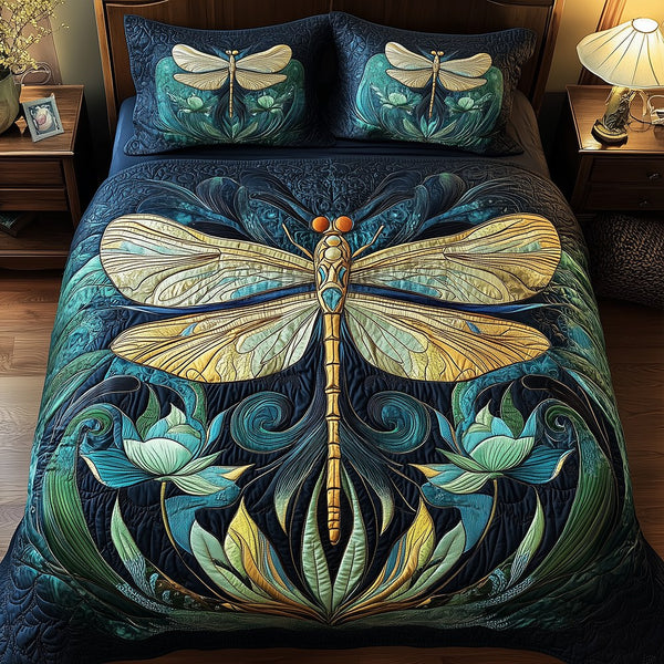 Dragonfly Dreams quilted 3-piece bedding set on a made bed with two matching pillow shams
