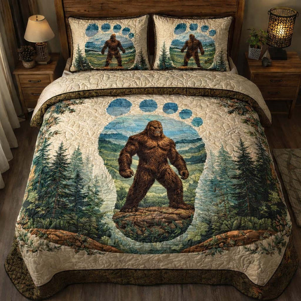 Bigfoot Paw Emblem quilted 3-piece bedding set on a made bed with two matching pillow shams