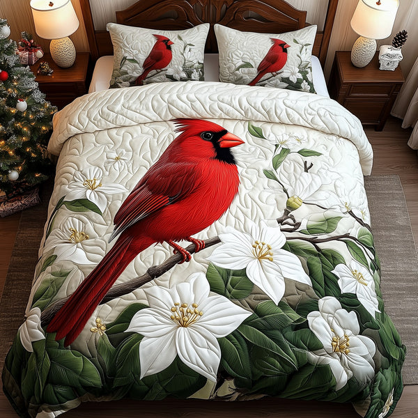 Cardinals in Bloom quilted 3-piece bedding set on a made bed with two matching pillow shams