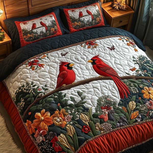 Cardinal Hearts Together quilted 3-piece bedding set on a made bed with two matching pillow shams
