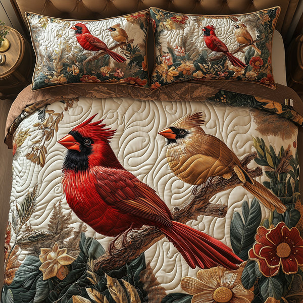 Cardinal Love Dance quilted 3-piece bedding set on a made bed with two matching pillow shams