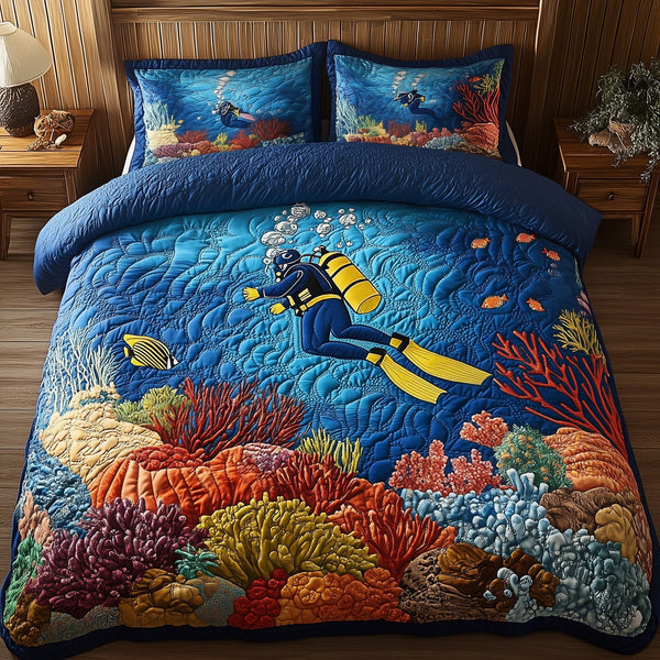 Deep Blue Discovery quilted 3-piece bedding set on a made bed with two matching pillow shams