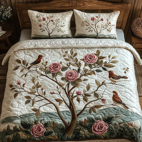 Elegance Rose quilted 3-piece bedding set on a made bed with two matching pillow shams