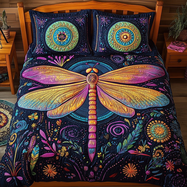 Dragonfly quilted 3-piece bedding set on a made bed with two matching pillow shams
