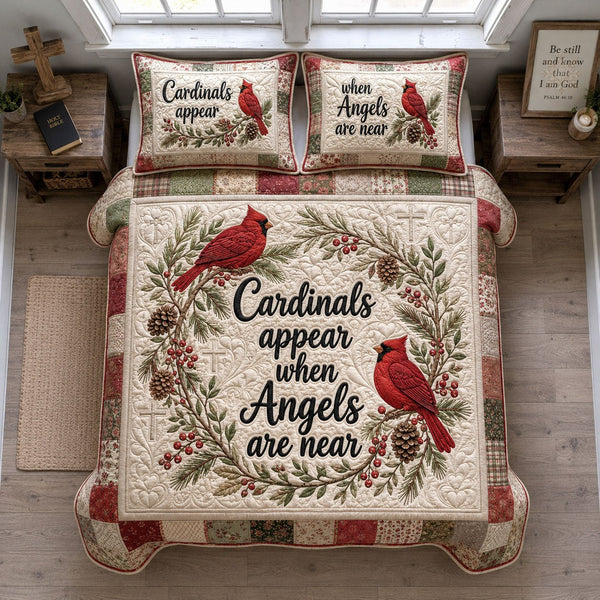 Cardinals Of Heaven Faith quilted 3-piece bedding set on a made bed in a softly lit bedroom