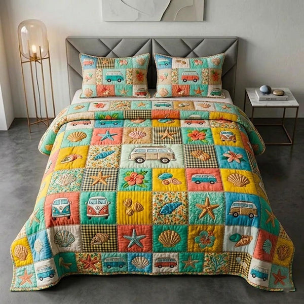 Beachside quilted 3-piece bedding set on a made bed in a light coastal bedroom