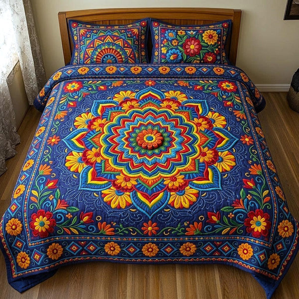 Fiesta Cultura quilted 3-piece bedding set on a made bed with two matching pillow shams