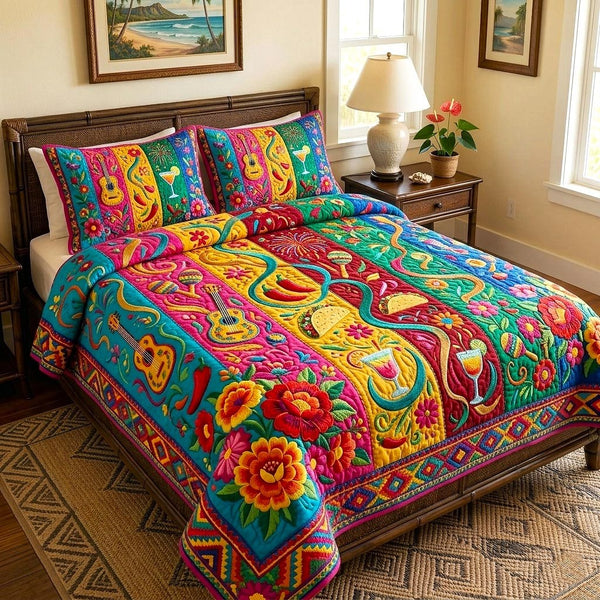 Colorful Fiesta quilted 3-piece bedding set on a made bed with two matching pillow shams