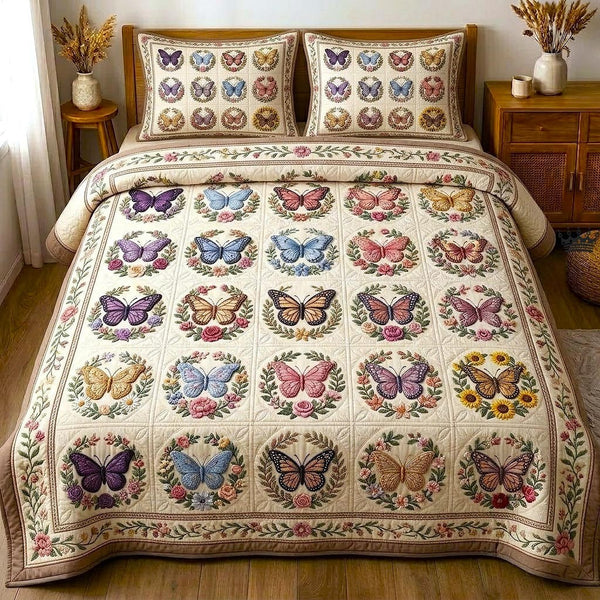 Butterfly Dream quilted 3-piece bedding set on a made bed with two matching pillow shams