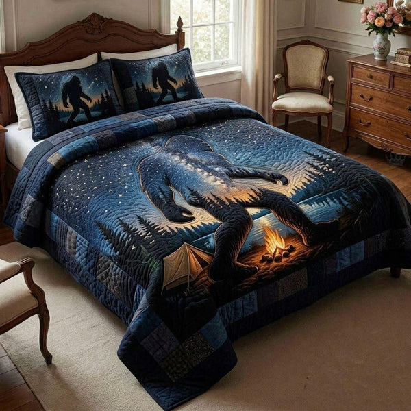 Bigfoot Trail quilted 3-piece bedding set on a made bed with two matching pillow shams