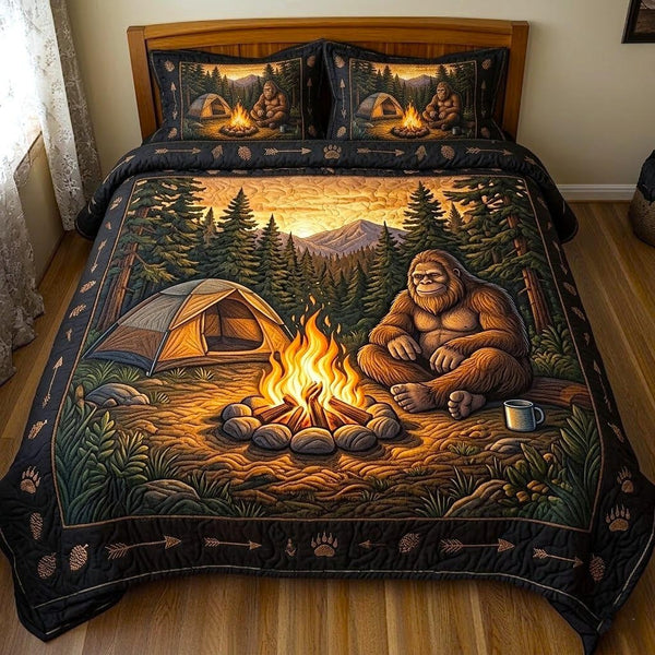 Bigfoot Trail quilted 3-piece bedding set on a made bed with two matching pillow shams