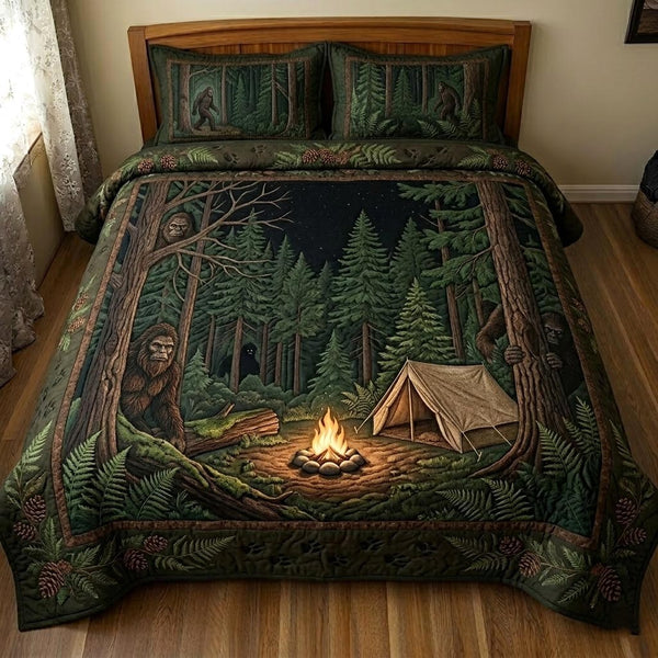 Bigfoot Trail quilted 3-piece bedding set on a made bed with two matching pillow shams