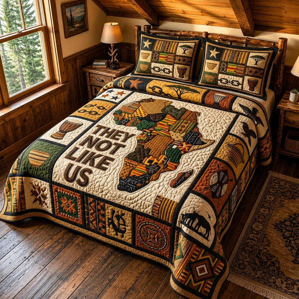 Black Excellence quilted 3-piece bedding set on a made bed with two matching pillow shams