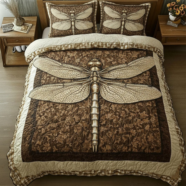 Dragonfly quilted 3-piece bedding set on a made bed with two matching pillow shams