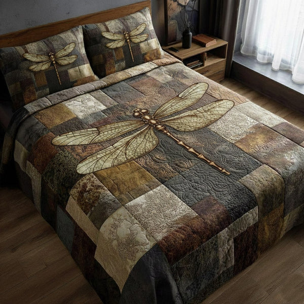 Dragonfly quilted 3-piece bedding set on a made bed with two matching pillow shams