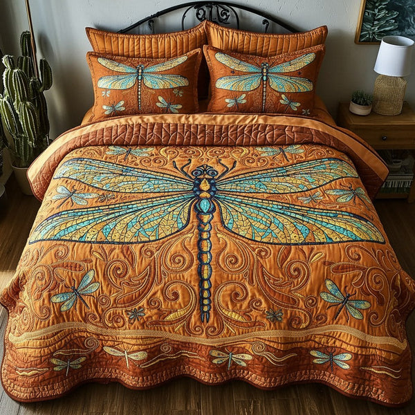 Dragonfly quilted 3-piece bedding set on a made bed with two matching pillow shams
