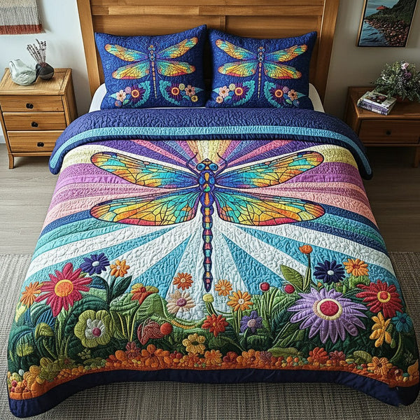 Dragonfly quilted 3-piece bedding set on a made bed with two matching pillow shams
