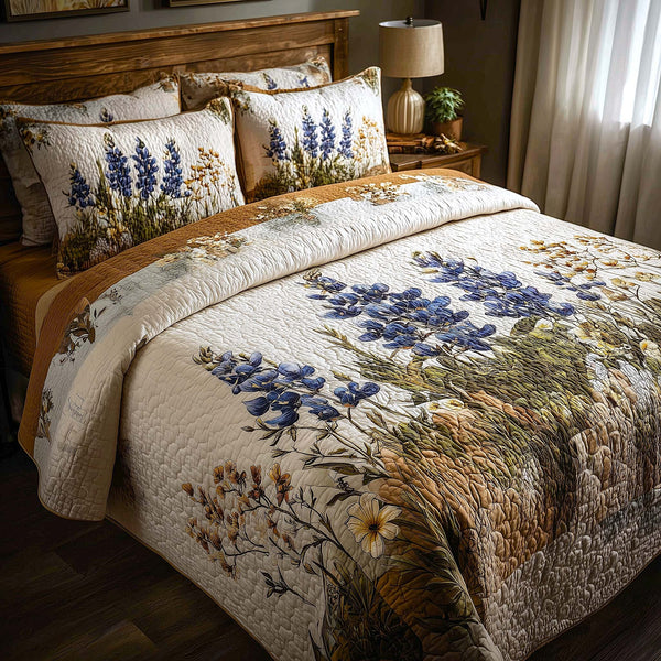 Bluebonnet Bliss quilted 3-piece bedding set on a made bed with two matching pillow shams