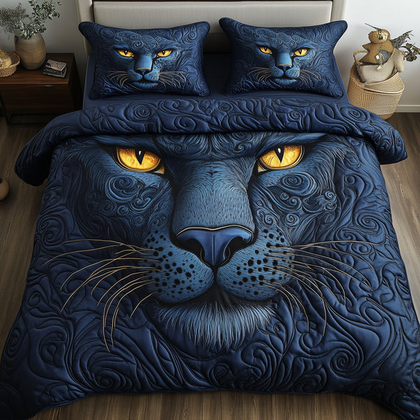 Blue Panther quilted 3-piece bedding set on a made bed with two matching pillow shams