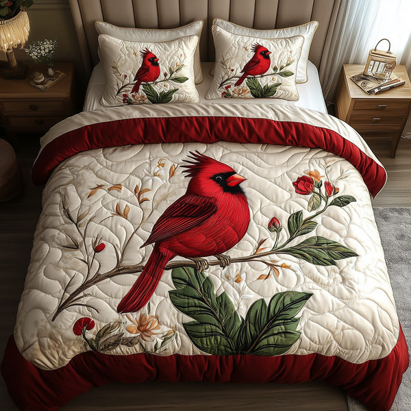 Elegant Red Cardinal quilted 3-piece bedding set on a made bed with two matching pillow shams