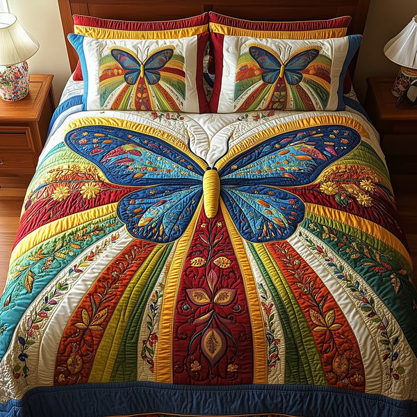 Butterfly Charm quilted 3-piece bedding set on a made bed with two matching pillow shams