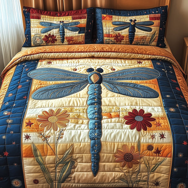 Dragonfly Charm quilted 3-piece bedding set on a made bed with two matching pillow shams