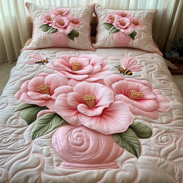 Camellia quilted 3-piece bedding set on a made bed with two matching pillow shams