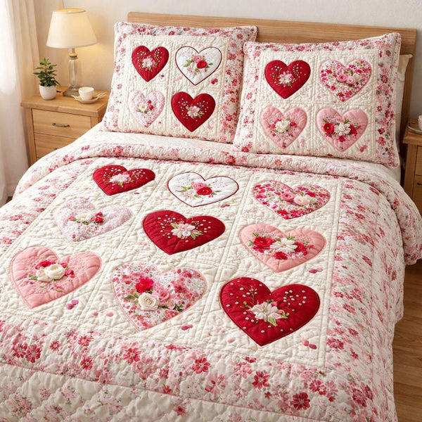 Elegant Heart quilted 3-piece bedding set on a made bed with two matching pillow shams
