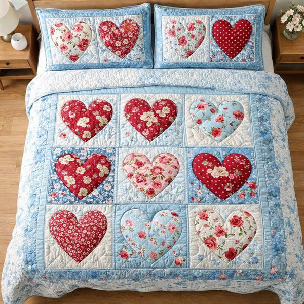 Elegant Heart quilted 3-piece bedding set on a made bed with two matching pillow shams