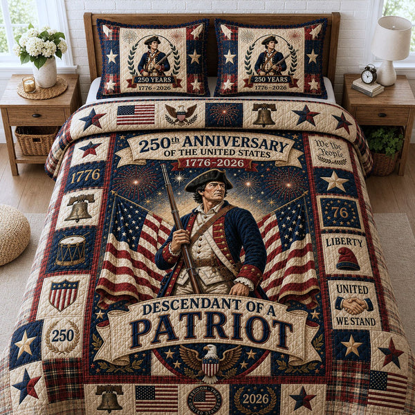 Descendant Of A Patriot quilted 3-piece bedding set on a made bed in a warmly lit bedroom