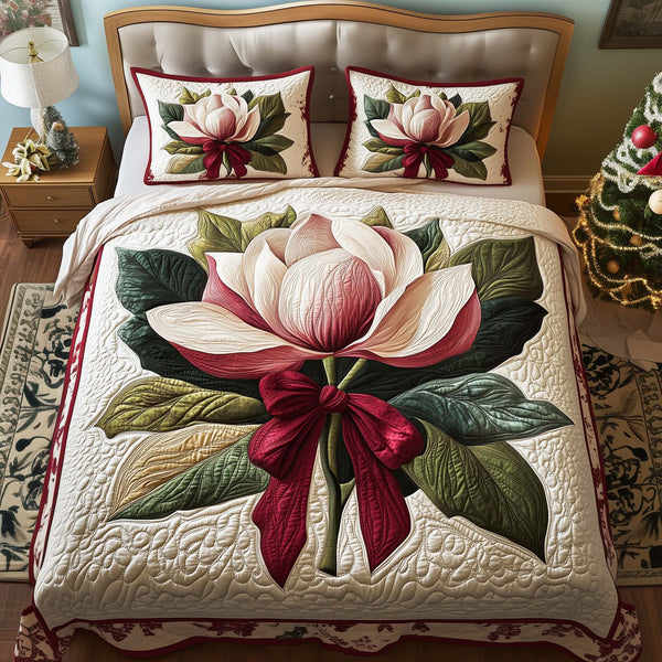 Bow Magnolia quilted 3-piece bedding set on a made bed with two matching pillow shams
