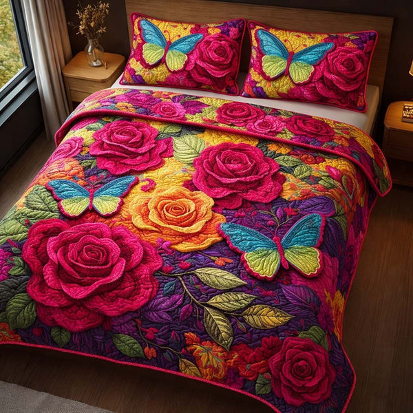 Butterfly Roses quilted 3-piece bedding set on a made bed with two matching pillow shams