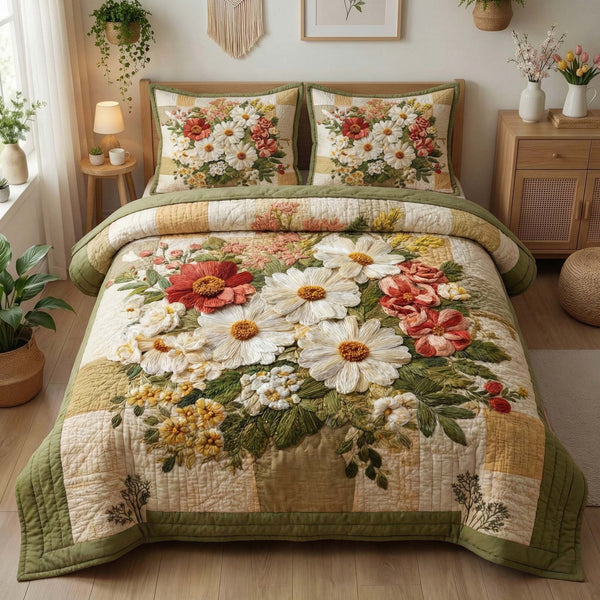 Blossom Grace quilted 3-piece bedding set on a made bed with two matching pillow shams