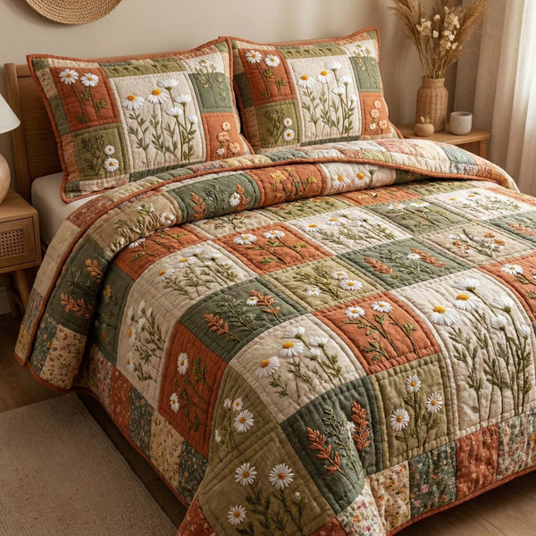 Blossom Grace quilted 3-piece bedding set on a made bed with two matching pillow shams