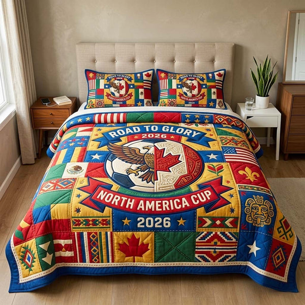 Eagle Crest quilted 3-piece bedding set on a made bed in a warmly lit bedroom