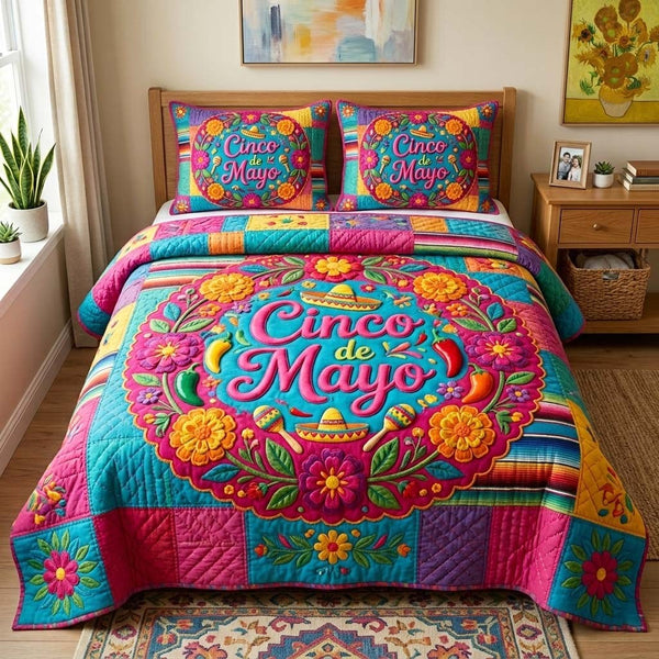 Fiesta Bloom quilted 3-piece bedding set on a made bed with two matching pillow shams