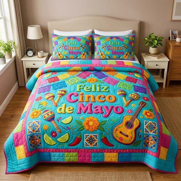 Fiesta Colors quilted 3-piece bedding set on a made bed with two matching pillow shams