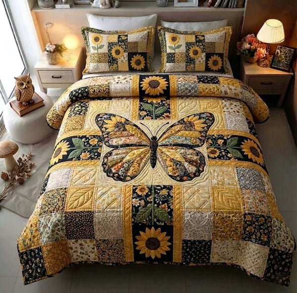 Amber Wings quilted 3-piece bedding set on a made bed with two matching pillow shams