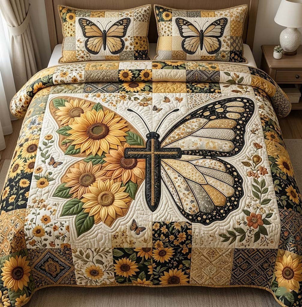Amber Wings quilted 3-piece bedding set on a made bed with two matching pillow shams