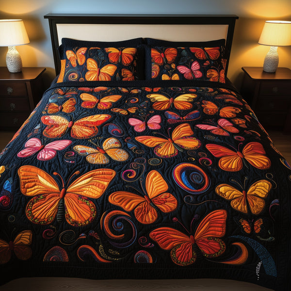 Butterflies Deep Night quilted 3-piece bedding set on a made bed with two matching pillow shams