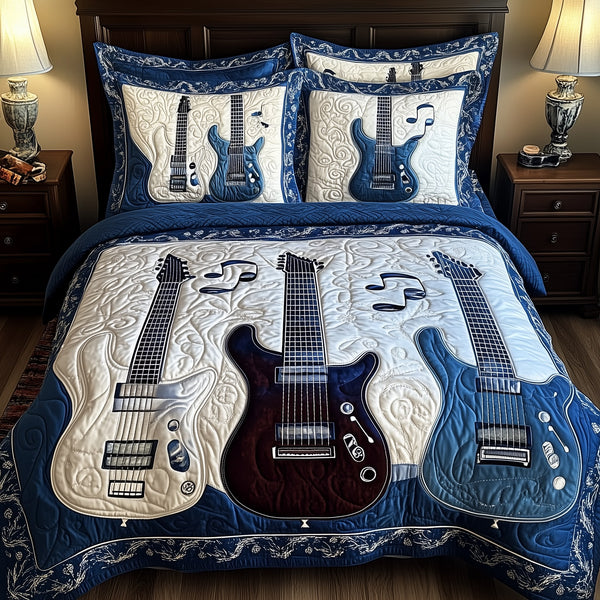 Blue Rock and Roll quilted 3-piece bedding set on a made bed with two matching pillow shams