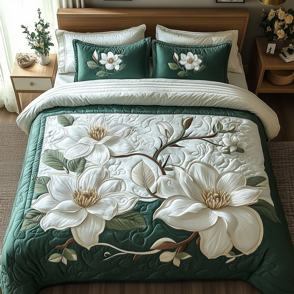 Elegant Blooming Magnolia quilted 3-piece bedding set on a made bed with two matching pillow shams