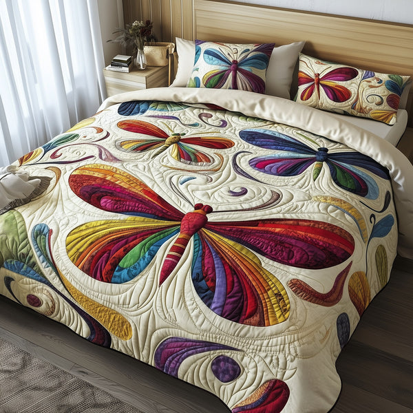 Elegance Dragonfly quilted 3-piece bedding set on a made bed with two matching pillow shams