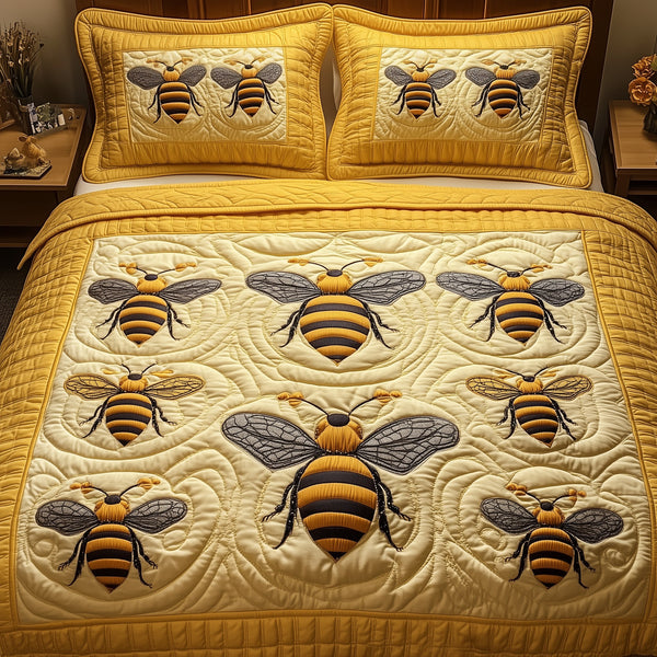 Bee quilted 3-piece bedding set on a made bed with two matching pillow shams