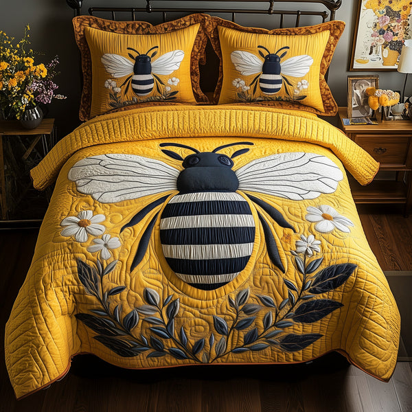 Bee quilted 3-piece bedding set on a made bed with two matching pillow shams