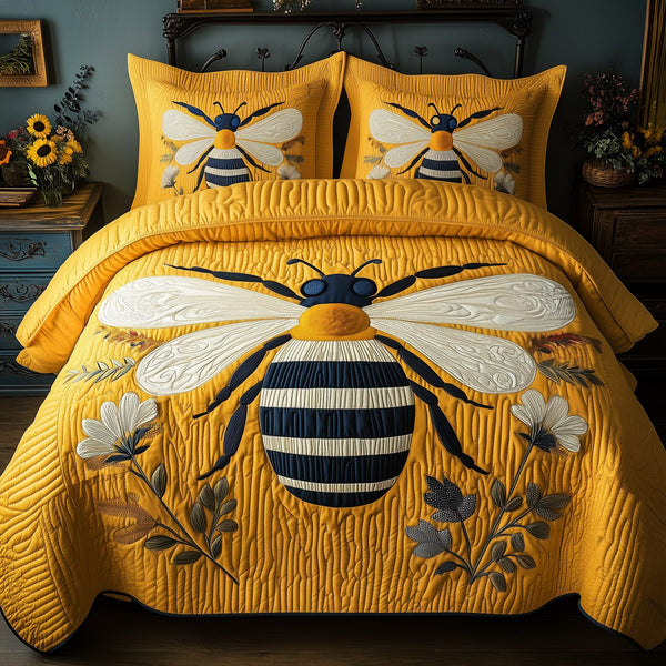 Bee quilted 3-piece bedding set on a made bed with two matching pillow shams