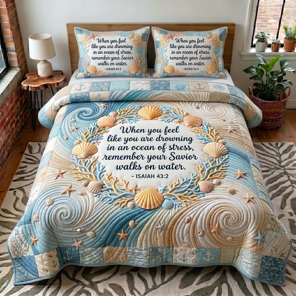 Coastal Blessings quilted 3-piece bedding set on a made bed in a light coastal bedroom